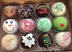 an assortment of decorated chocolates in a box