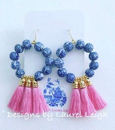 two pairs of blue and pink beads with tassels