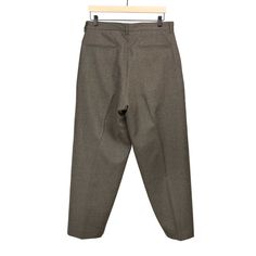 "These trousers are the true look of luxury. Wider, relaxed, loungey fit, an exquisite drape and overall great shape. The interior drawstring give the trousers an easy pant vibe without the look. These look best worn with an ill sweater vest or cardigan, some chunky footwear wouldn't be so bad either."---Kenshawn Details 100% wool; unlined Button closure, zip fly, interior drawstring Two slanted side pockets, two rear welt pockets Made in Japan Size & Fit Relaxed fit, take your typical number si Luxury Relaxed Fit Sweater With Button Closure, Luxury Men's Pants With Button Closure, Brown Wool Bottoms With Welt Pockets, Tailored Wool Straight Bottoms, Semi-formal Wool Trousers, Tailored Brown Wool Pants, Luxury Wool Trousers, Pleated Trousers, Belted Shorts