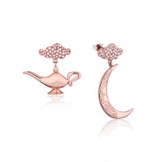 two earrings with birds on them, one in the shape of a bird and the other as