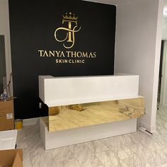 the tanya thomas skin clinic is located in an empty room with boxes on the floor