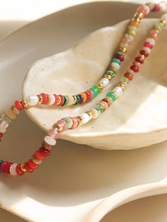 Add some color to your outfit with our Sunny Non-Tarnish Boho Color Beaded Necklace! Show your love for bright colors with this stunning piece. Not only does it add a pop of color, but it's also non-tarnishing for long-lasting wear. Perfect for any boho style lover. Non-Tarnish Boho Color Beaded Necklace Stainless Steel Natural stones & Pearls Chain Length (inch): 15 Extension Length (inch): 2 Colorful Vibrant Beaded Necklace With Round Beads, Vibrant Multicolor Beaded Necklaces With Round Beads, Vibrant Beaded Necklaces With Round Beads As Gift, Color Beaded Necklace, Boho Color, Colorful Boho, Pearl Chain, Women Clothing Boutique, Chain Lengths