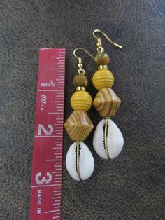 Wooden Beaded Earrings For Beach, Wooden Beads Earrings For Beach, Bohemian Yellow Earrings For Beach, Beach Wooden Bead Earrings, Brown Beaded Earrings For Beach With Dangling Beads, Handmade Yellow Beaded Earrings For Beach, Brown Beaded Dangling Earrings For Beach, Brown Dangling Bead Earrings For Beach, Unique Yellow Jewelry For The Beach