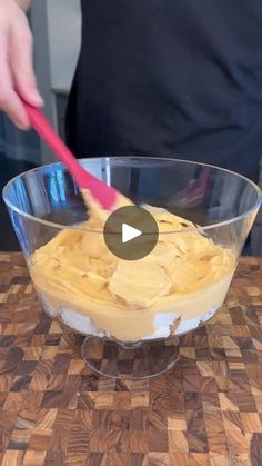 a person is mixing peanut butter in a bowl