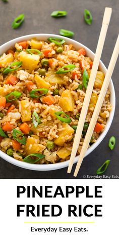 pineapple fried rice in a white bowl with chopsticks on the side and text overlay reading pineapple fried rice everyday easy eats