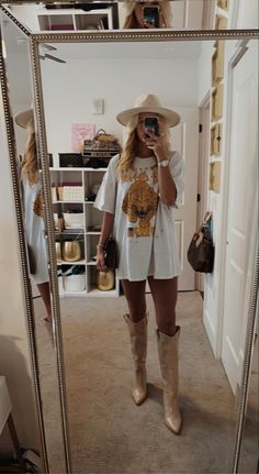 Knee High Country Boots Outfit, Knee High Boots Outfit Country, Oversized Tshirt Outfit Knee High Boots, Knee High Boot Outfits Fall, Winter Dress With Knee High Boots, Oversized Tshirt Western Outfit, Winter Oversized Tshirt Outfit, Oversized Tshirt Outfit Cowboy Boots, Oversized Tshirt Country Concert Outfit