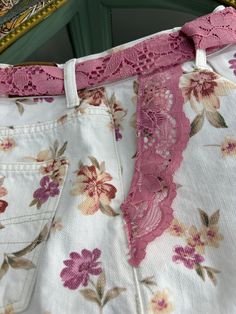 I love the white floral with the pink lace and I gave it a matching belt for you to configure to the style of your choice or simply go with out it. These are pre-owned, up-cycled shorts. Wash in cold and lay flat to dry, light iron on the lace. Size US 8 Inseam 3" Waist 28", High Waist Top of belt to bottom lace is 13" 4 functional pockets Lace Trim Summer Shorts, Summer Lace Shorts With Lace Trim, Pink Floral High-waisted Shorts, Spring High-waisted Shorts With Lace Trim, Pink Lace Shorts, Handmade Jewelry Bracelets, Painting Furniture Diy, Pink Lace, Handmade Boho