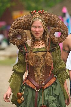 a woman in costume walking down the street