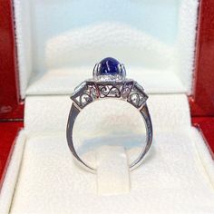 BRAND-NEW!! ONE OF A KIND, HANDCRAFTED RING. EXTREMELY STUNNING! 2.37 total carats Certified HEATED, CEYLON BLUE SAPPHIRE ring. This ring offers an important statement of who you are with a 1.95 carats, VIVID ROYAL BLUE, transparent SAPPHIRE. Accentuating the sapphire are the 36 F/VS, and sparkling natural diamonds! Set in finest 18K Solid White Gold ring! THE ITEM YOU SEE IN THE PICTURES IS THE EXACT ITEM YOU WILL GET! ONE OF A KIND, NO DUPLICATES OR TWINS SUGGESTED RETAIL VALUE: $6,500 BLUE SA Timeless Cabochon Sapphire Ring, Classic Oval Cabochon Sapphire Ring With Bezel Setting, Classic Sapphire Ring Oval Cabochon, Classic Sapphire Ring With Oval Cabochon Bezel Setting, Formal Domed Cabochon Sapphire Ring, Classic Cabochon Sapphire Ring For Formal Occasions, Classic Formal Cabochon Sapphire Ring, Classic Formal Sapphire Cabochon Ring, Timeless Cabochon Sapphire Ring Gift