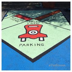 a parking sign painted on the side of a road