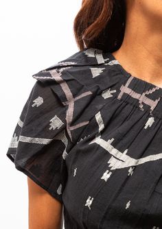 This cropped one shoulder top is a work of art. Inspired by Spain, this fabric motif shines on Mirth's take on a classic Indian design. Intricate hand-loomed Jamdani details make this an elegant classic to pair with their Paros skirt or Mirth pants. Across shoulder and waist are elastic for a perfect fit; can be worn bloused to show more skin, or straight to cover up. Jamdani is a special weave that takes great time and skill to master. the entire process happens without aid of modern technology Back Covered Blouse Designs, Heritage Crafts, One Shoulder Top, Paros, One Shoulder Tops, Hand Loom, Modern Technology, Indian Design, Online Purchase