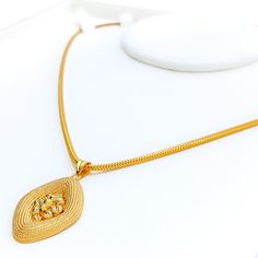 This 22k gold pendant, weighing 4.5 grams, features a delightful decorative design that radiates elegance. The yellow gold finish enhances its intricate details, making it a standout piece for any jewelry lover. With a length of 1.5 inches, this pendant strikes the perfect balance between subtlety and sophistication. Ideal for those who appreciate fine craftsmanship and timeless beauty, this pendant can be paired with any chain of your choice. Its exquisite design and high-quality gold make it a versatile and treasured addition to any jewelry collection. PRODUCT DETAILS Gold Purity(karat): 22k Gold Weight(grams): 4.5 Item Finish: Yellow Gold Pendant Length: 1.5" Chain: Not Included 22k Yellow Gold Flower Pendant Necklace, Gold Temple Pendant Necklace For Formal Occasions, Formal Gold Temple Necklace Pendant, 22k Gold Pendant Necklace With Locket, Elegant Gold Temple Necklace With Large Pendant, Gold Flower Pendant Necklace In 22k, Gold Filigree Pendant Temple Necklace, Gold Filigree Temple Necklace Pendant, 22k Gold Filigree Pendant Necklace