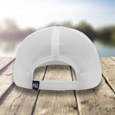 The ultimate water-resistant fishing accessory for avid tuna anglers is The Tuna Chaser hat. This stylish hat comes in a sleek white and gray color scheme and features a bold Six Knots Performance Fishing tuna badge on the front. Crafted with the highest quality materials, this hat is designed to keep you cool and comfortable all day long. The mesh back provides excellent ventilation, allowing air to flow freely and keep your head dry and sweat-free, even during those long and grueling fishing e Adjustable Lightweight White Baseball Cap, White Lightweight Trucker Hat For Outdoor, Adjustable White Snapback Hat For Outdoor, White Adjustable Snapback Hat For Outdoor, White Lightweight Sun Hat For Outdoor, White Sun Hat With Curved Brim For Outdoor Activities, Adjustable White Baseball Cap With Breathable Mesh, Adjustable White Snapback Hat For Outdoor Activities, White Curved Brim Snapback Hat For Outdoor