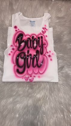 Designs by Galveston Airbrush! ♡ Feel free to contact me with any questions or custom orders. ✧ Our Designs on these cute White beater Tank tops are handmade with the artists' skilled Hands and that makes each item unique ✧ Each design includes up to TWO names or words with up to THREE specified COLORS. SIZES: Available for ADULTS and YOUTH DESIGN PLACEMENT: All designs are airbrushed on the FRONT of our White Beater Tank top unless specified otherwise. International orders may have an additiona Cute Crew Neck Tank Top With Letter Print, Cute Pink Cotton Vest, Cute Cotton Racerback Tank Top, Cute Pink Letter Print Tank Top, Cute Sleeveless Crop Top With Letter Print, Customizable Trendy Pink Tops, Customizable Sleeveless Tops, Wife Beater Tank, Bright Pink Eyeshadow