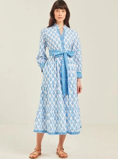 Block-printed by hand in fresh shades of blue, our Kerala dress is a timeless piece you’ll treasure for years to come. Features an open, v-neck placket, gently fitted waist and full length sleeves with a pretty, border cuff. We love the contrast between the border and buta in this clever print-mix piece. An effortless easy style which can be dressed up or down. Pink City Prints was founded to preserve the traditional crafts of India's Pink City and our collections speak to a more thoughtful, authentic way of life. Blue Split Neck Dress For Daywear, Elegant Blue Split Neck Dress, Midi And Top, Kerala Dress, Women Cotton Dress, Pink City, Daytime Dresses, Block Printing, Vacation Dresses