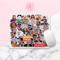 a mouse pad with stickers on it sitting next to a pink and white marble surface