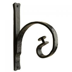 an iron door handle with the letter s on it's side and a hook in the middle