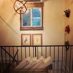 towels are folded on the rails in front of a window