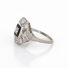 Elegant & finely detailed Art Deco era ring (circa 1920s to 1930s) crafted in 900 platinum.   Old mine and single cut diamonds total an estimated 0.75 carats (estimated at H-I colour and VS2-SI1 clarity).       The ring epitomises vintage charm and would make a lovely alternative engagement ring or right hand ring. The setting features fine milgrain detail along with a lacy filigree design in an octagonal setting. The low profile ring (5mm - 0.19 inches) sits comfortably on the finger. The side Detailed Art, Vintage Art Deco Rings, Art Deco Wedding Rings, Right Hand Rings, Jewelry Lookbook, Alternative Engagement Rings, Filigree Design, Art Deco Era, Art Deco Diamond