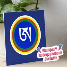 a blue card with the word support independent artists on it next to a potted plant