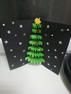 a christmas tree made out of folded paper