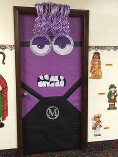 a door decorated to look like a minion with purple hair and googly eyes