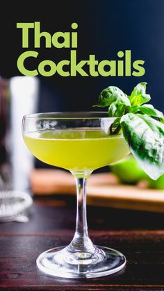 a cocktail in a coupe glass with basil garnish and the words thai cocktails