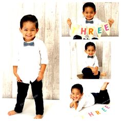 a little boy posing for a photo with his name on the shirt and bow tie