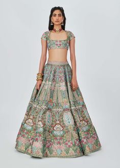 Editor's Note The multicoloured green heavy embellished and appliqued kali tissue lehenga is a mesmerizing piece of art. The intricate detailing and vibrant colors create a stunning visual impact. Paired with a beautifully designed blouse and a scallop dupatta, this ensemble exudes elegance and grace. Perfect for special occasions, it is sure to make a lasting impression with its unique and radiant charm. Note: The lehenga worn by model is a 16 panels design style Fabric: Tissue Color: Multicolo Luxury Multicolor Lehenga With Pallu Detail, Kali Lehenga, Tissue Lehenga, Scallop Dupatta, Aisha Rao, Embellished Lehenga, Lehenga With Blouse, Contrast Dupatta, Blouse Yoke