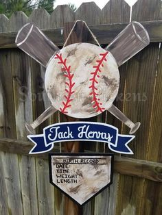 a wooden sign with baseballs and bats on it