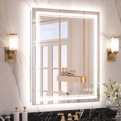 a bathroom sink with a large mirror above it and lights on the wall behind it