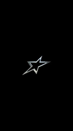 a black background with a silver star on it