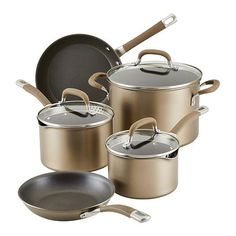 an assortment of pots and pans on a white background