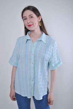 "Women vintage blue striped short sleeve holiday blouse, Size L Welcome to TARASCOMMON.ETSY.COM Unique clothing from the 20th century. Model tall - 170cm L. Sleeve - 10cm / 3.93inch; ( armpit to end of sleeve); Width - 50cm / 19.68inch; Length - 70cm / 27.55inch. All measurements are taken seam to seam while lying flat. Polyester/cotton. This item is vintage, so it can have some defects. Additional photos can be send We are glad that you are interested in lots that we sell. Wish you a good shopp Holiday Blouse, Holiday Blouses, Textured Blouse, Women Ski, Unique Clothing, Striped Short, Blue Vintage, Plaid Print, Unique Outfits