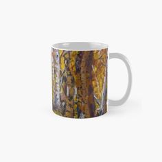 an abstract painting on a coffee mug with trees in the background and yellow leaves all over it