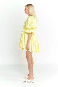 This gorgeous little dress by Aje is perfect for a special occasion or event. This style features Aje's signature voluminous sleeves and asymmetric hemlines in a summery lemon-hue. Pair it with low white heels for a formal look or sneakers for a casual setting. This style runs large so we recommend choosing one size down. Perfect for race days, weddings, vineyards, birthdays and daytime events. Mini length Intricately gathered Asymmetric neckline and hem Signature Aje voluminous sleeve Fully lined Low White Heels, Floral Dress Formal, Asymmetric Dress, Dress Men, Voluminous Sleeves, Asymmetric Neckline, Formal Look, White Heels, Gothic Dress