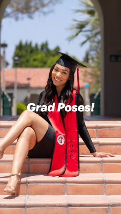 a woman sitting on steps wearing a graduation cap and gown with her legs crossed in the air