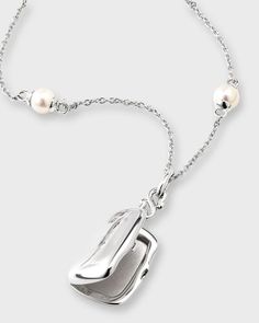 Monica Rich Kosann Britt locket necklace.Holds two images, images easily push into the inside of the locket.Approx. 17'L Locket, approx. 0.5'W x 0.7'T.Sterling silver.Dyed freshwater cultured pearls.Adjustable length.Lobster clasp closure.Wipe clean.Imported Monica Rich Kosann Jewelry, Monica Rich Kosann, Pearl Chain Necklace, Freshwater Cultured Pearls, Pearl Chain, Locket Necklace, Cultured Pearls, Locket, Lobster Clasp