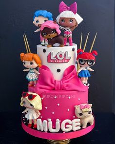 a birthday cake decorated with littlest pet shop dolls