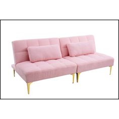 a pink couch sitting on top of a white floor