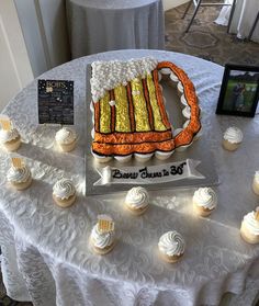 cupcakes on a table with an american flag cake