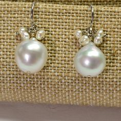 DESCRIPTION: Thank you for coming in! 14K solid white gold earrings with 11mm South Sea white baroque pearls and seed pearl accents! Full of luster and elegance! ! It looks much much nicer on your ears! You will receive the exact pair of earrings in the pictures! WEIGHT: 4.63 Grams LENGTH: 1 inch MATERIAL: 14K Solid White Gold, South Sea White Pearl, Seed Pearls Pear-shaped Akoya Pearl Silver Earrings, Classic White Briolette Earrings, Sterling Silver Briolette Pearl Earrings As Gift, Luxury Briolette Pearl Drop Earrings, Briolette Sterling Silver Pearl Earrings As Gift, Pearl White Sterling Silver Pearl Earrings, Silver Akoya Pearl Earrings With High Luster, Fine Jewelry: Pear-shaped Sterling Silver Pearl Earrings, Silver Pearl Earrings With Lever Back For Anniversary