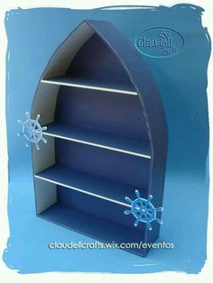 an open book shelf with snowflakes on the top and bottom shelves in blue