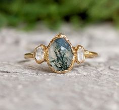 a close up of a ring on a rock