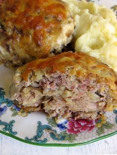 meatloaf and mashed potatoes on a plate with a flowered design border