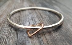 A chunky solid sterling silver sparkle bangle with a solid 9ct rose gold open heart charm. Silver Kada, Silversmithing Jewelry, Charm Bangles, Bracelets Silver, Peridot Jewelry, Jewelry Bracelets Silver, Gold Ring Designs, Sterling Silver Jewelry Handmade, Sterling Silver Jewellery