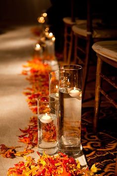 two pictures with candles on the ground and leaves in vases next to each other