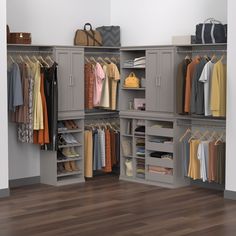 an organized closet with clothes and handbags