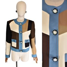 Step back into the vibrant 90s with this eye-catching C'EST COMMEÇA jacket. Crafted from warm wool, this long-sleeve piece showcases a striking color block pattern in shades of brown, blue, black, and off-white, perfectly capturing the era's bold geometric style. 🧥 Coat/Jacket Details * Pattern, Color and Material: This jacket features a unique geometric color block design, blending rich tones for a dynamic and stylish look. The high-quality wool fabric ensures both warmth and durability, makin Luxury Casual Color Block Outerwear, Resin Buttons, Jacket Details, 90s Jacket, Color Block Jacket, Jacket With Pockets, Block Pattern, Block Design, Jacket Vintage