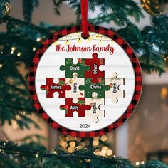 a personalized christmas ornament hanging from a tree